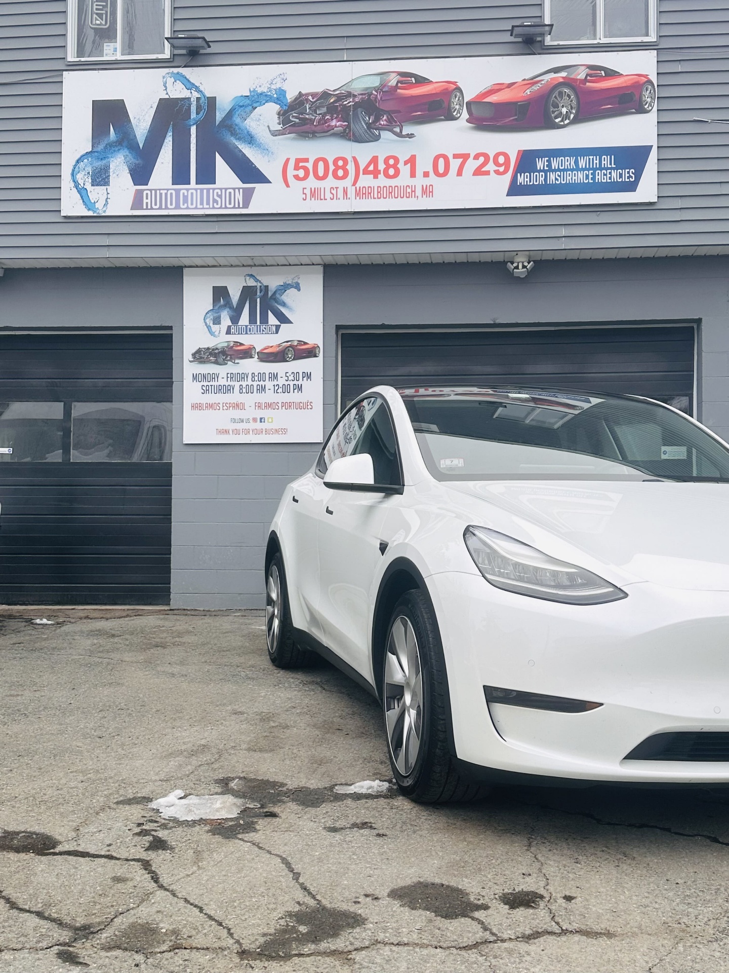 Tesla parked at the MK Auto Collision shop